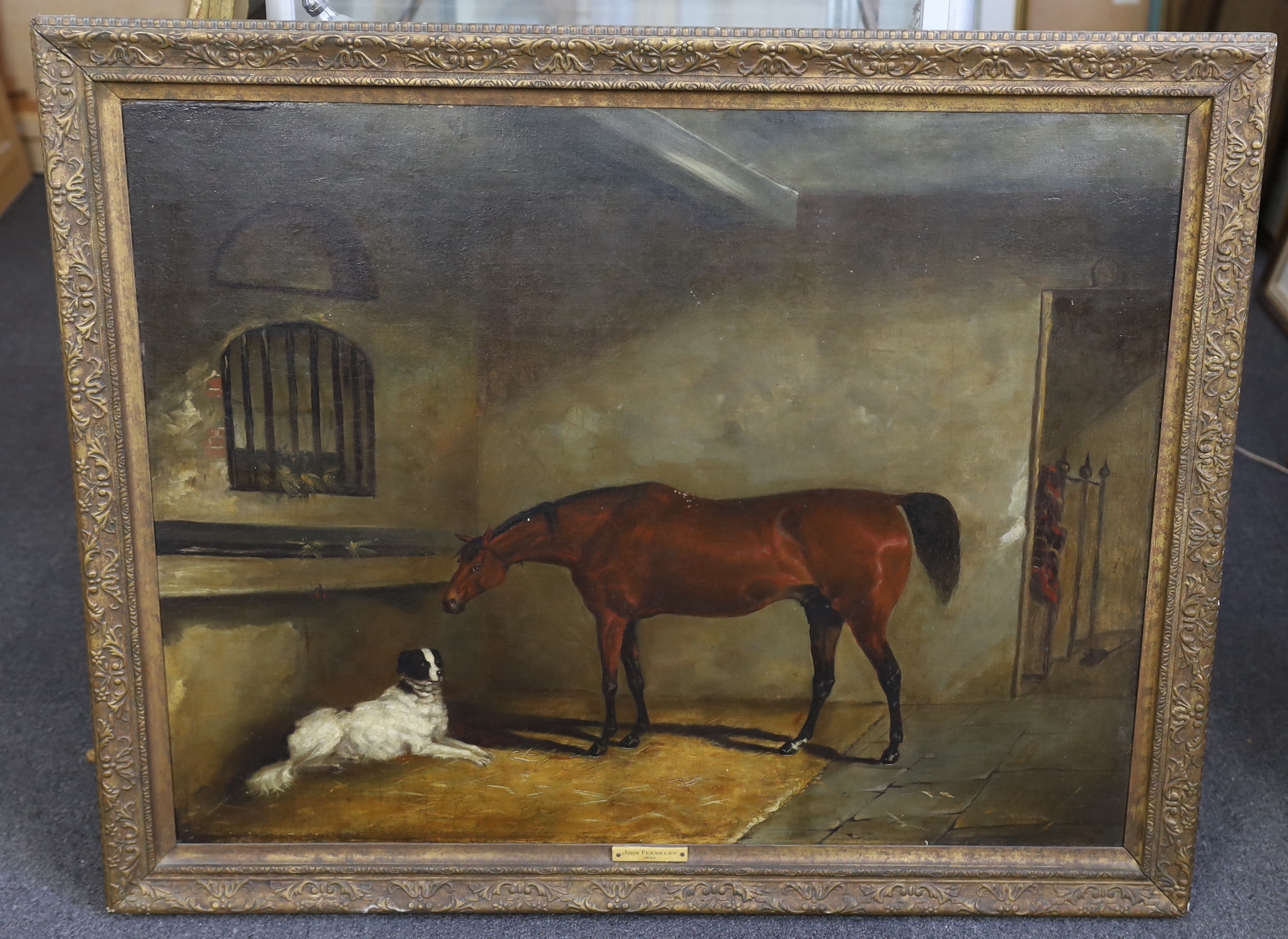 Circle of John Ferneley Snr (1762–1860), A bay horse and a dog in a stable, oil on board, 70 x 90cm